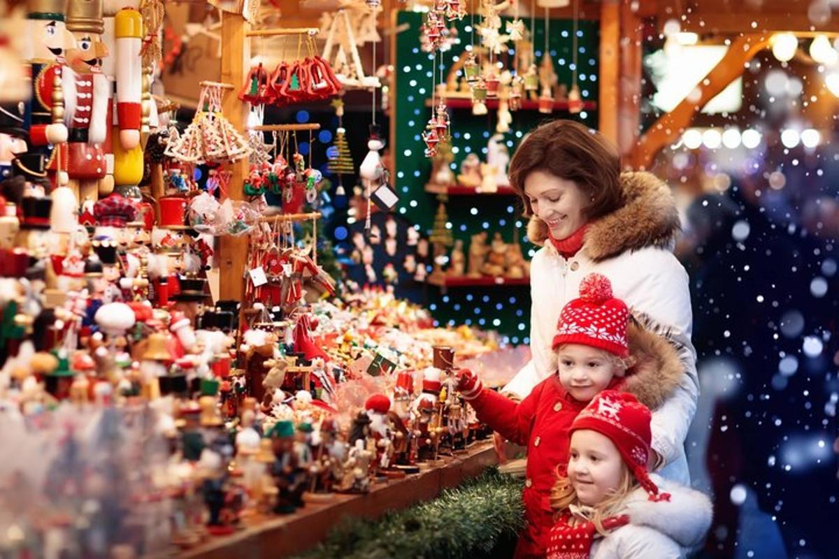 a woman and a child looking at a christmas display