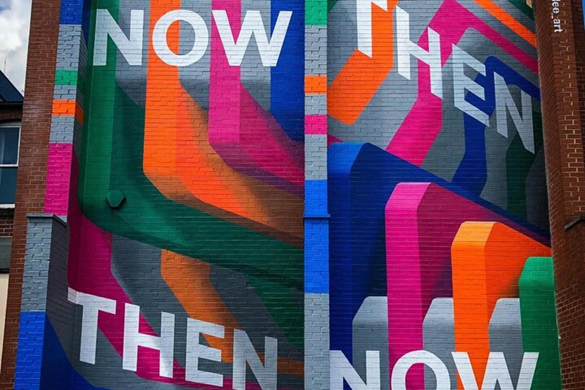 a mural on the side of a building with the words now then now them now