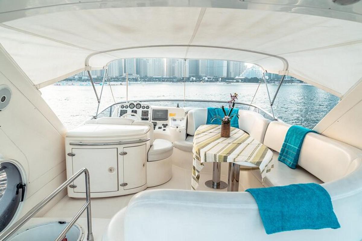a white boat with a table in the middle