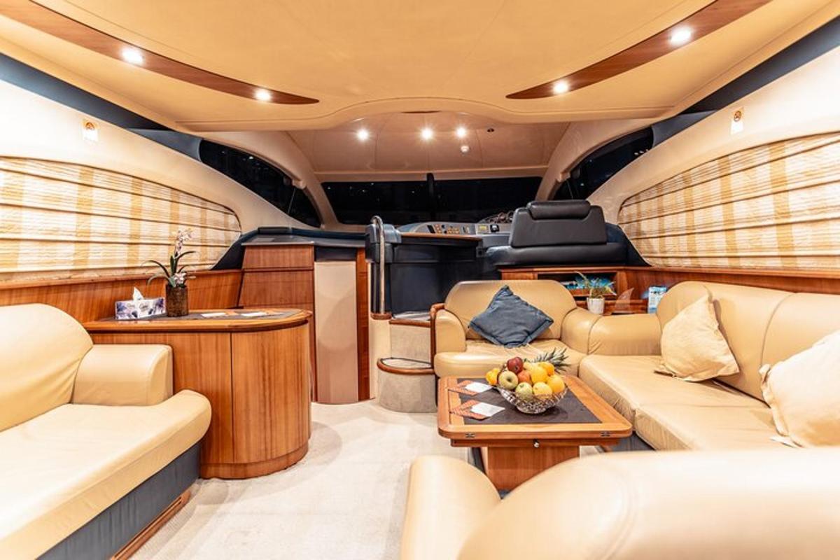 a luxurious interior of a boat with tables and couches