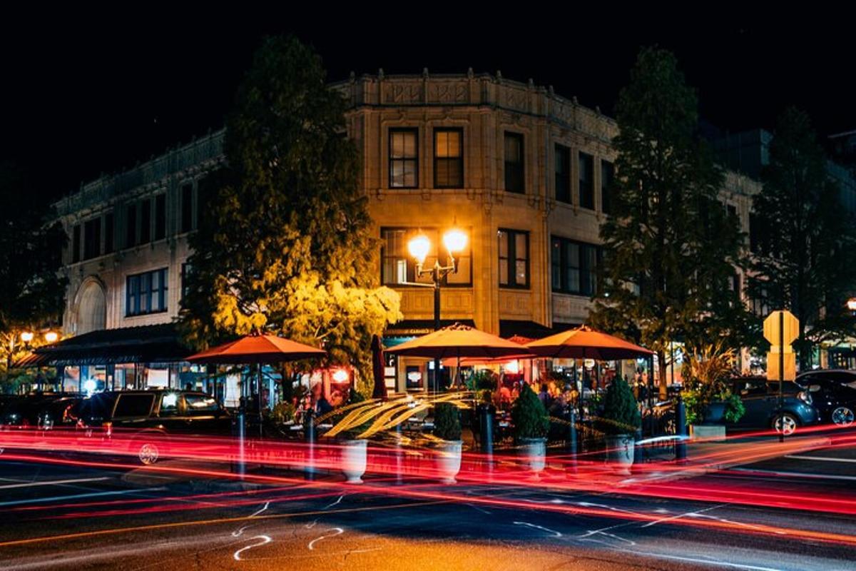 a city street at night with a building