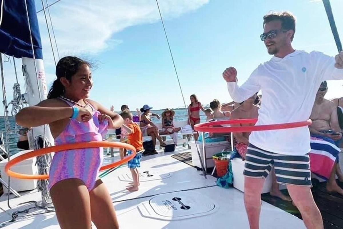 a man and a girl playing on a boat