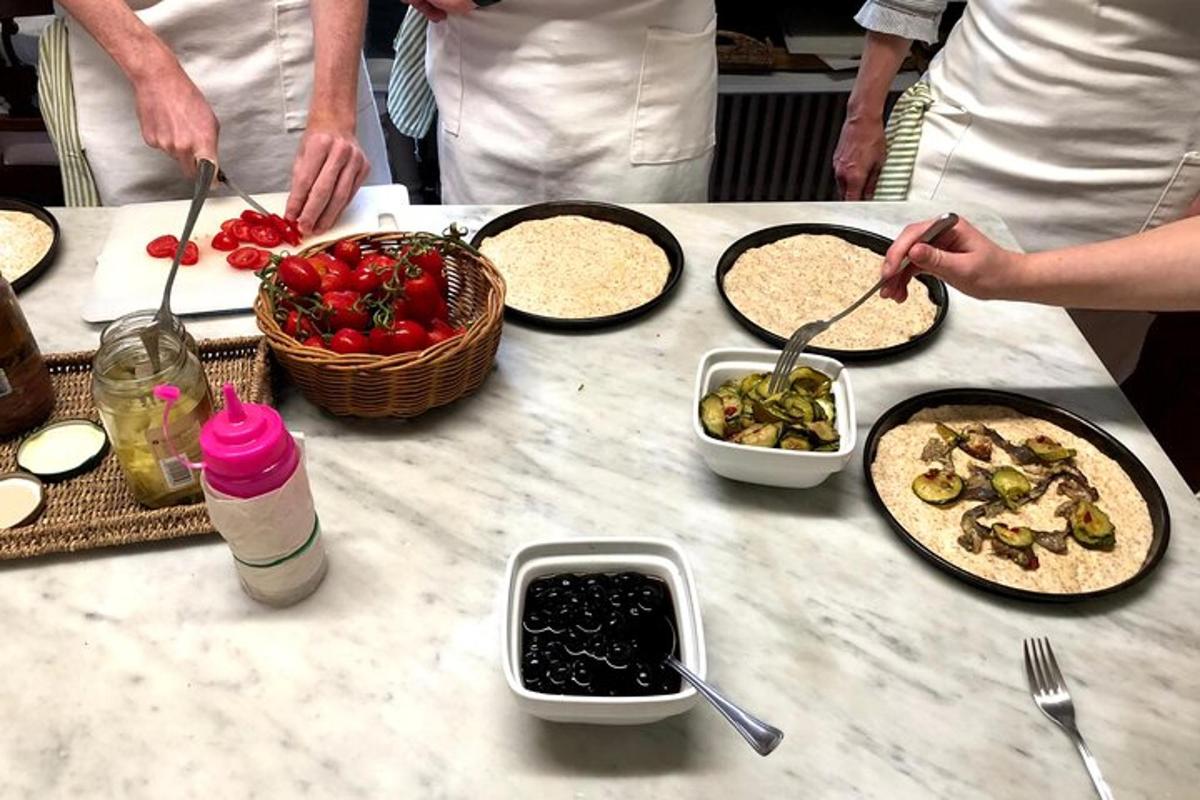 a group of people preparing food on a table