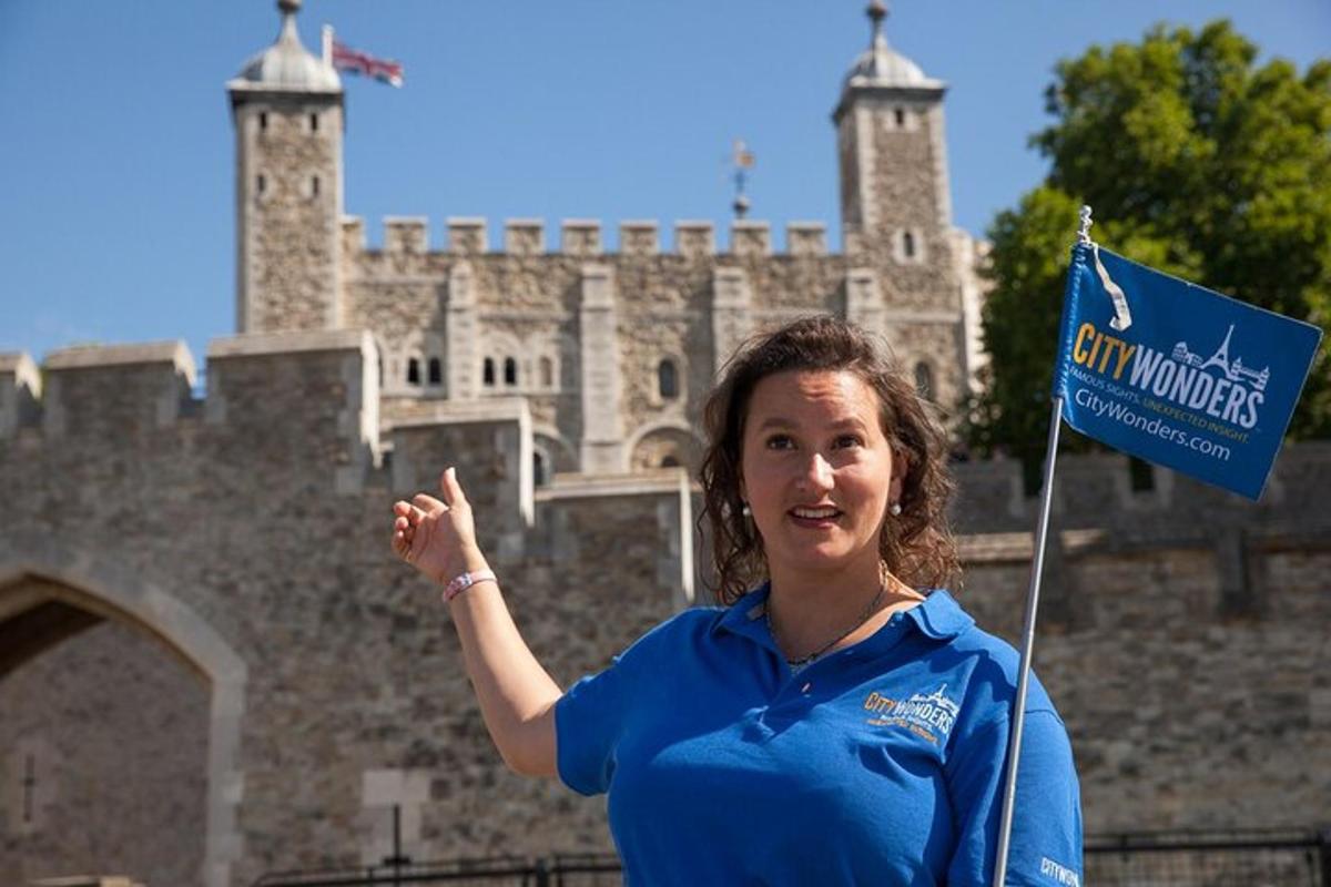 a woman holding a flag in front of a castle