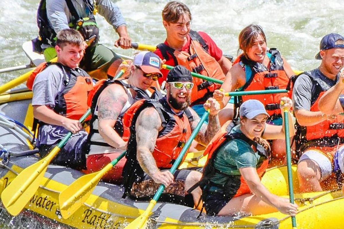 a group of people on a raft in the water