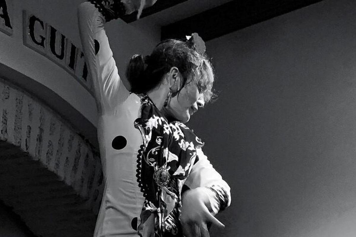 a woman with her arm up in the air