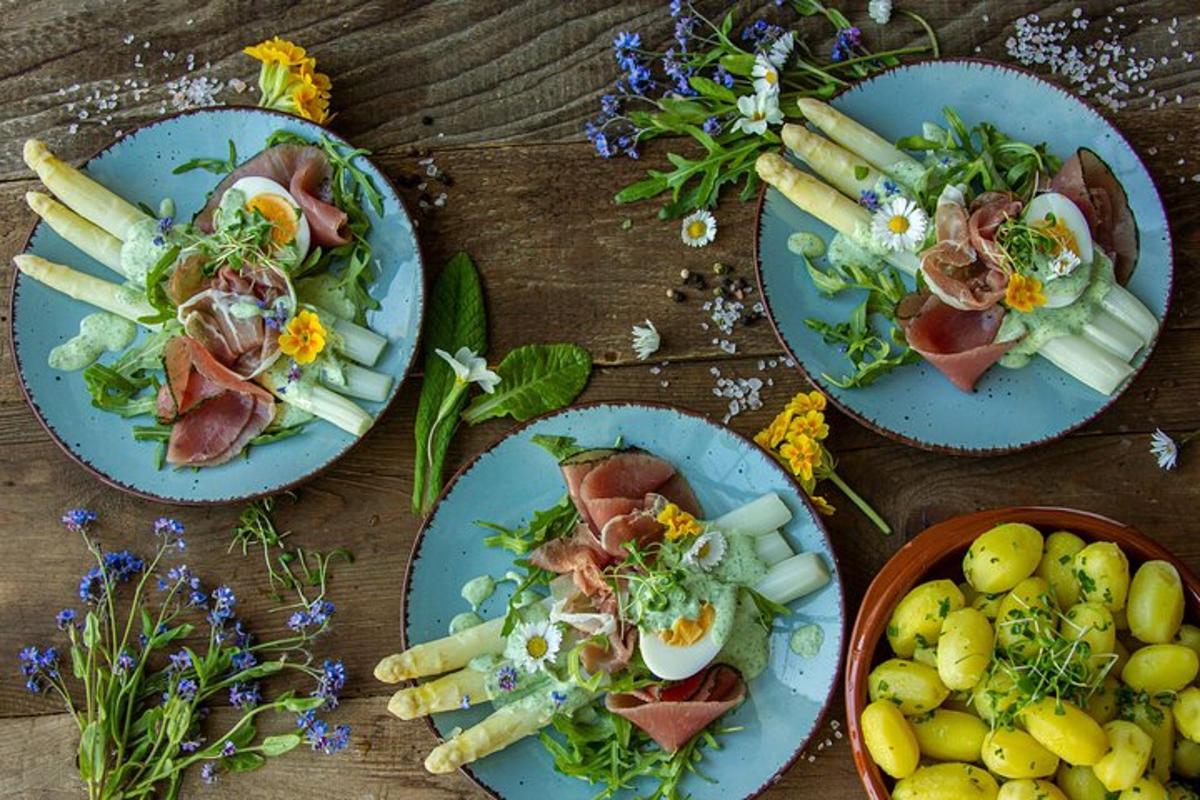 four plates of food on a wooden table