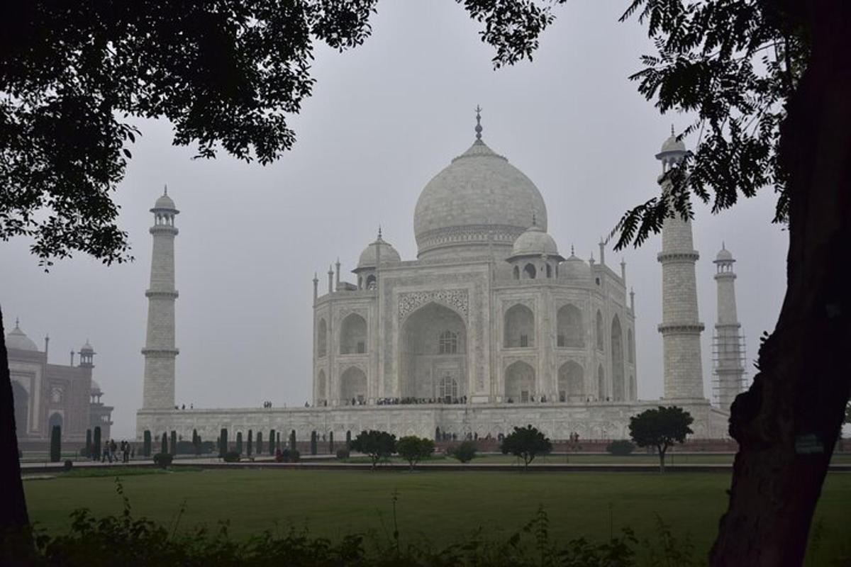 a large white building with two domes on top