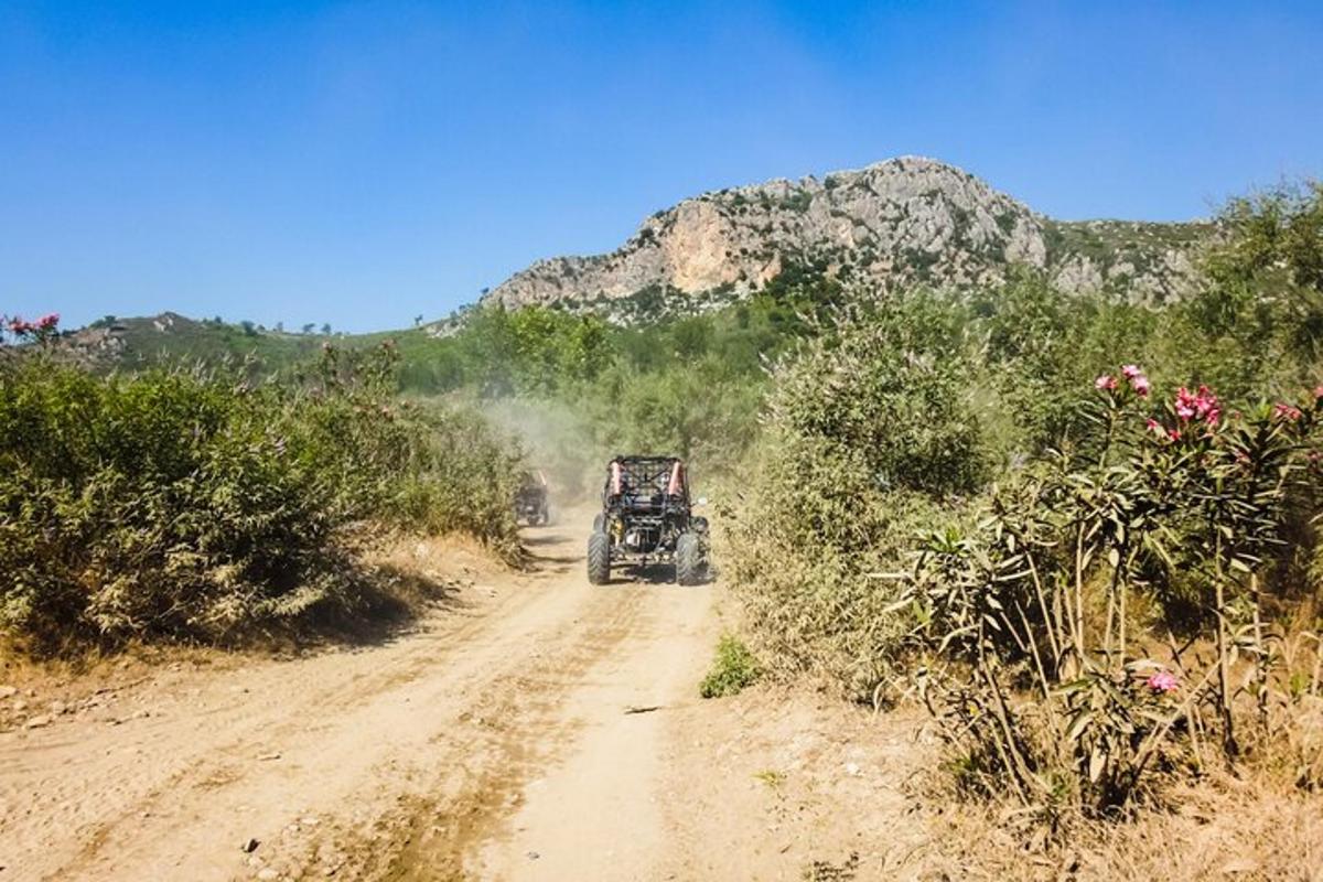 a jeep driving down a dirt road