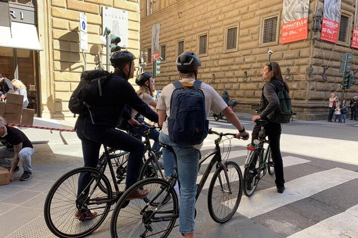 a group of people riding bikes on a street