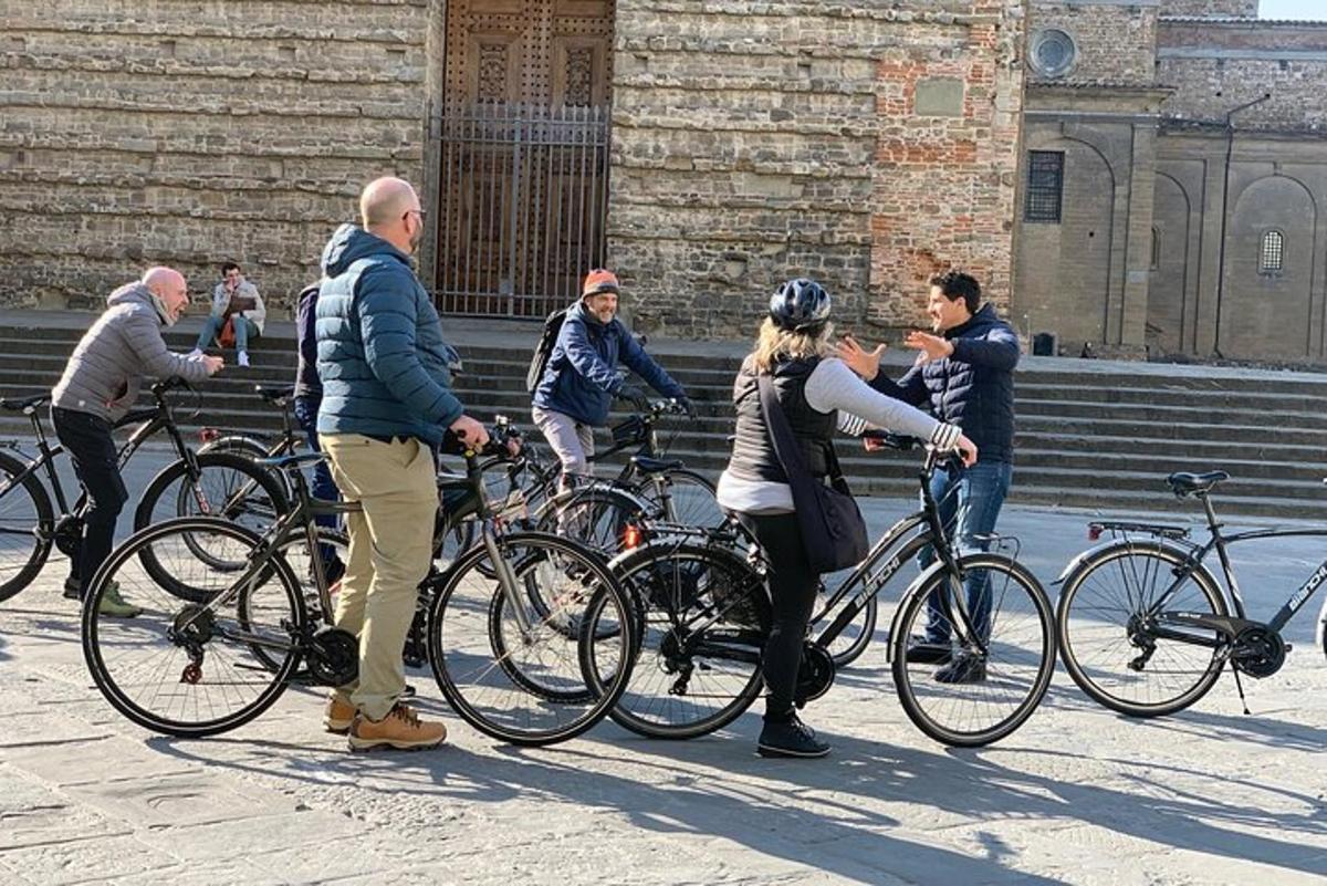 a group of people standing next to their bikes