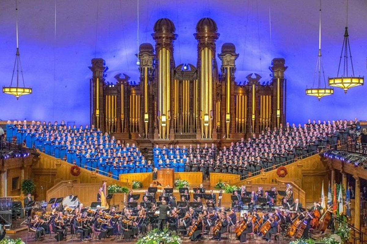 an orchestra in front of a large organ