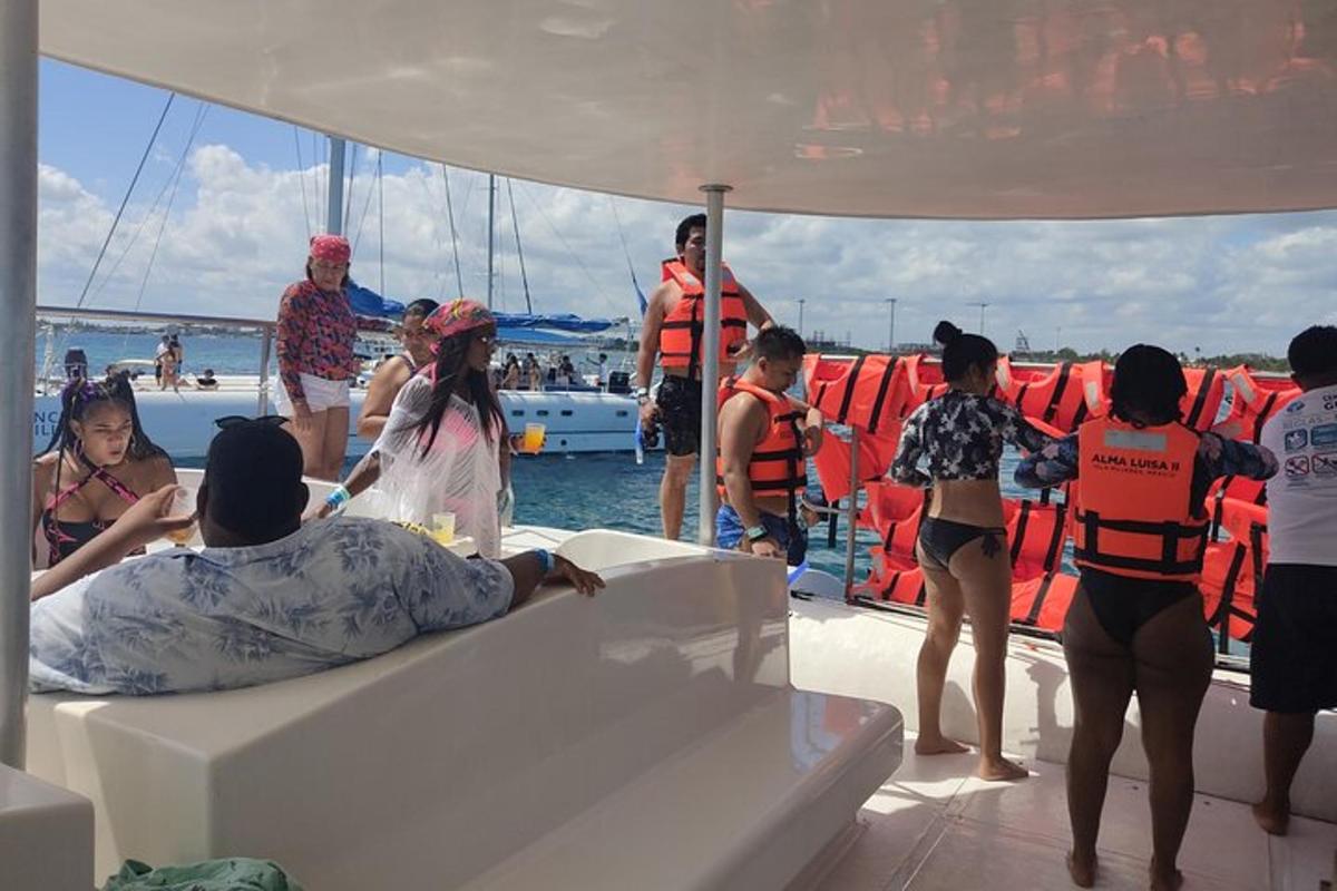 a group of people on a boat in the water