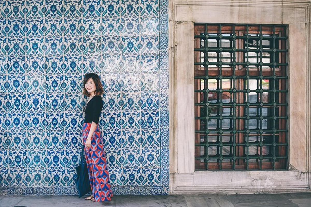 a woman standing in front of a wall