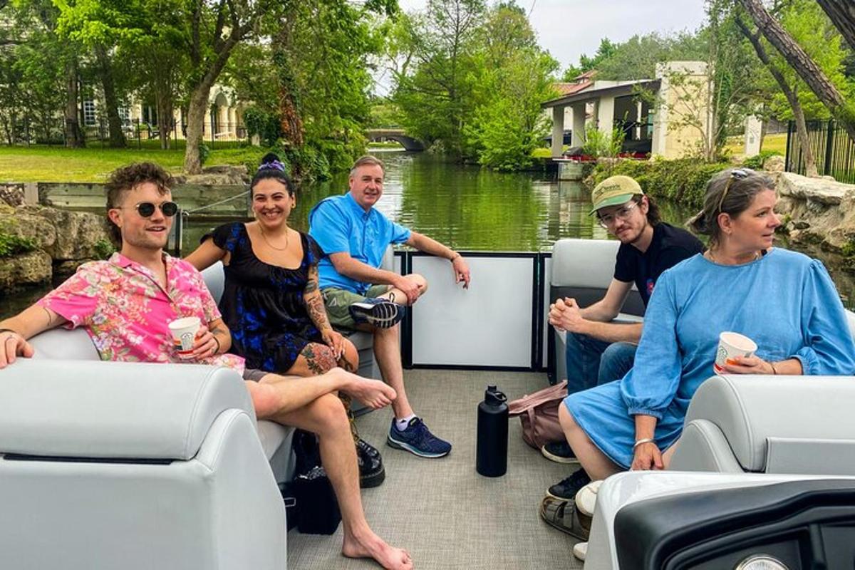 a group of people sitting on a boat on a river