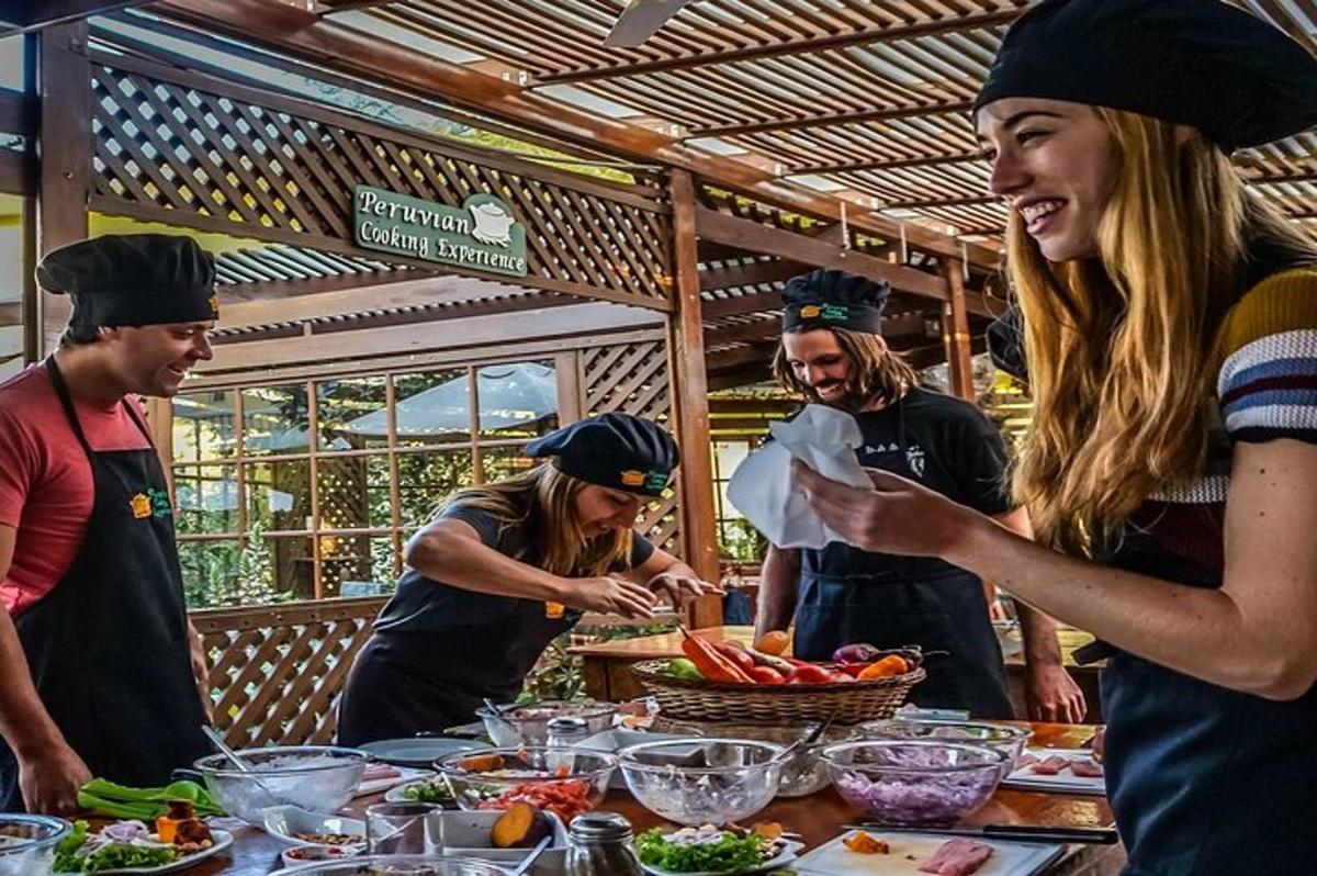 a group of people standing around a table with food