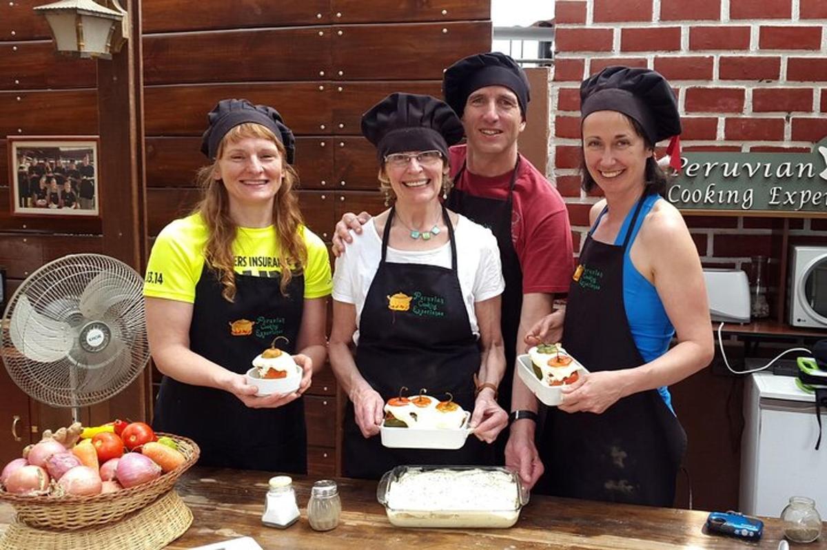a group of people standing in a kitchen with food