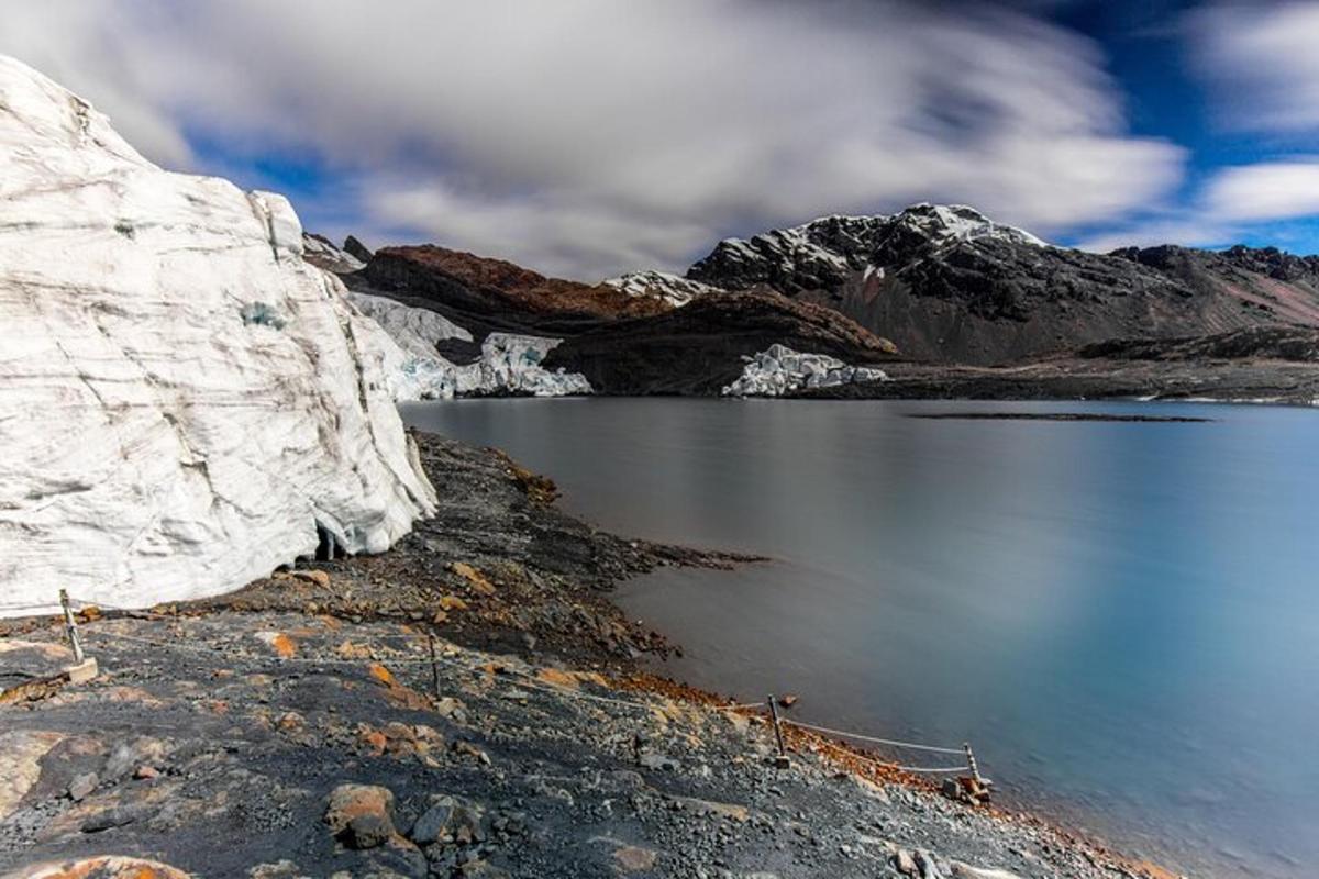 a large body of water with a mountain in the background
