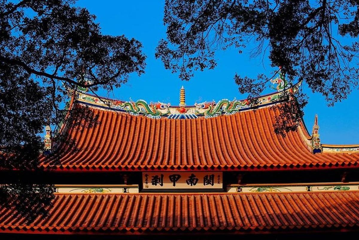 a building with a red roof with a tower