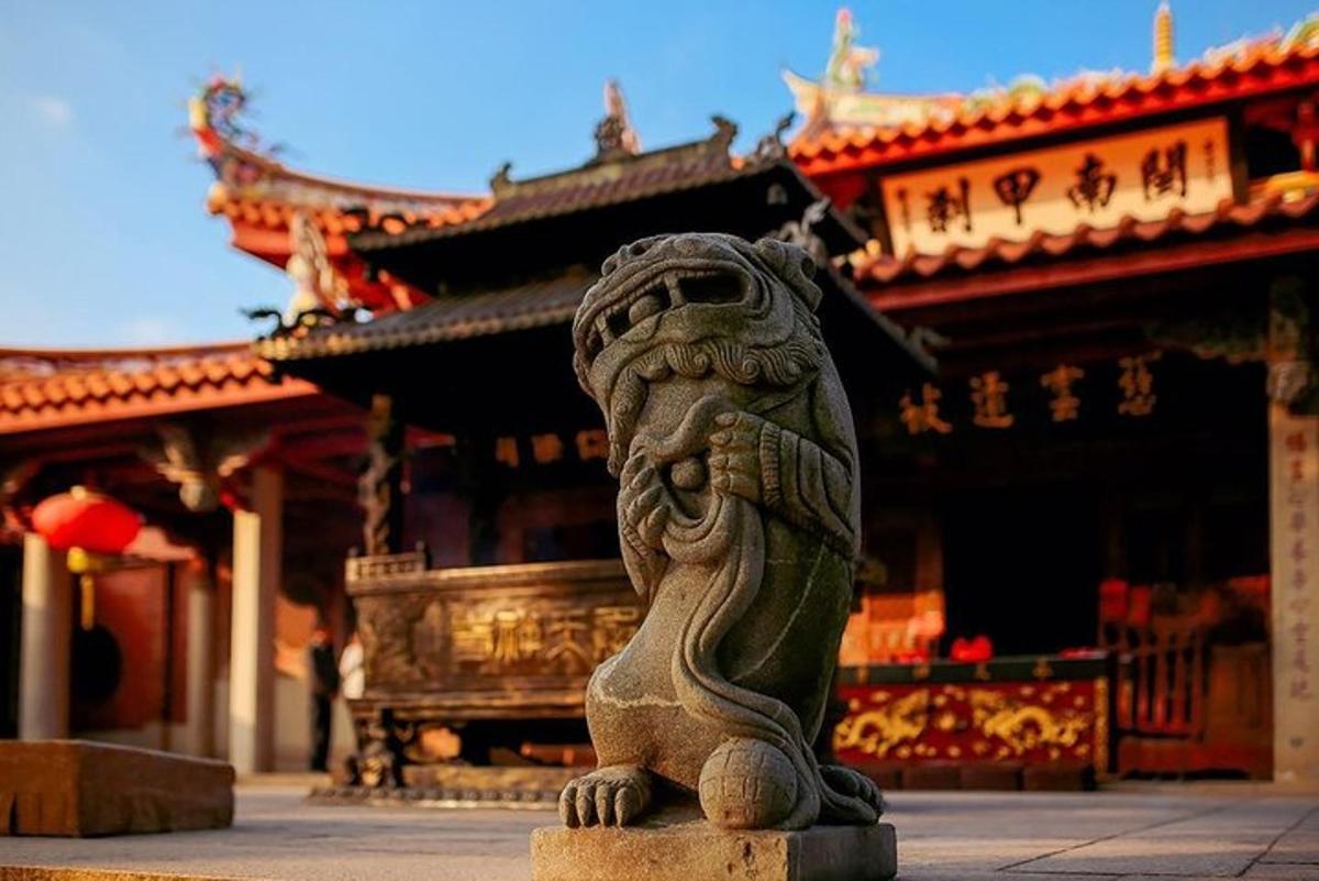 a statue of a lion in front of a building