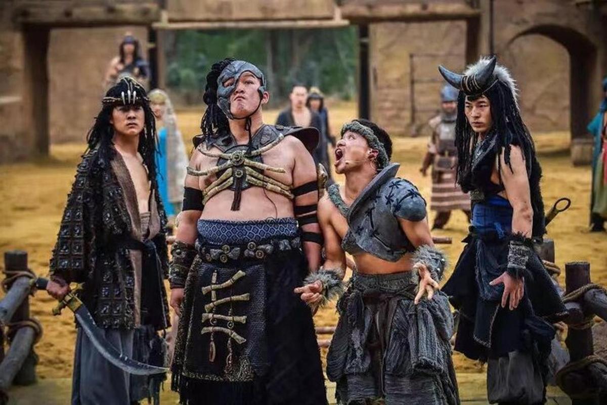 a group of people dressed in costumes standing together