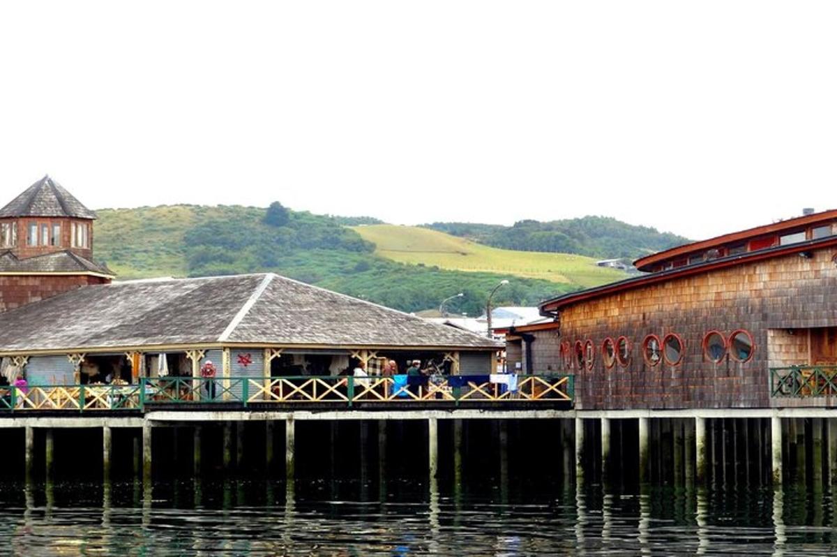 a restaurant on the side of a body of water