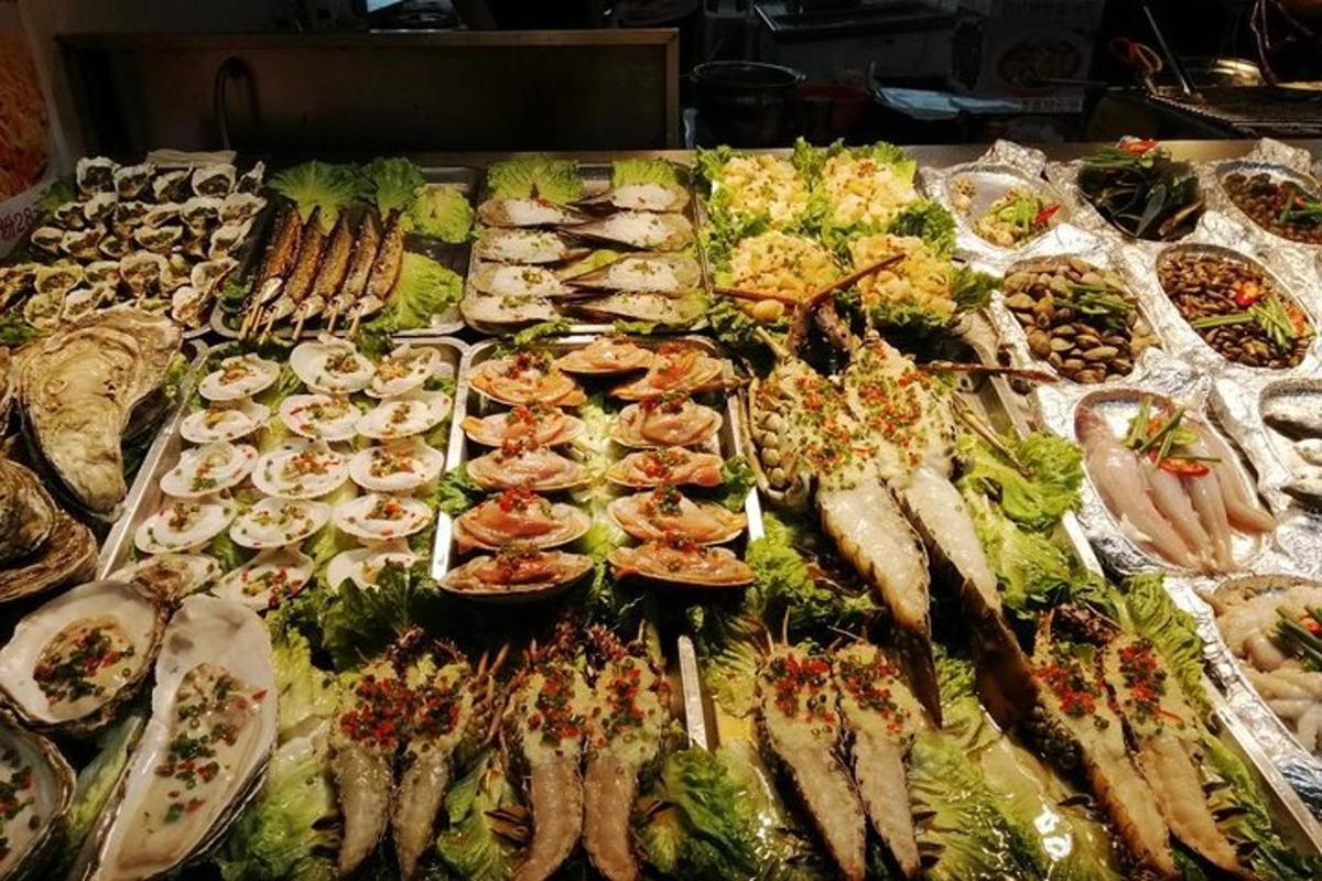 a buffet with many different types of seafood and vegetables