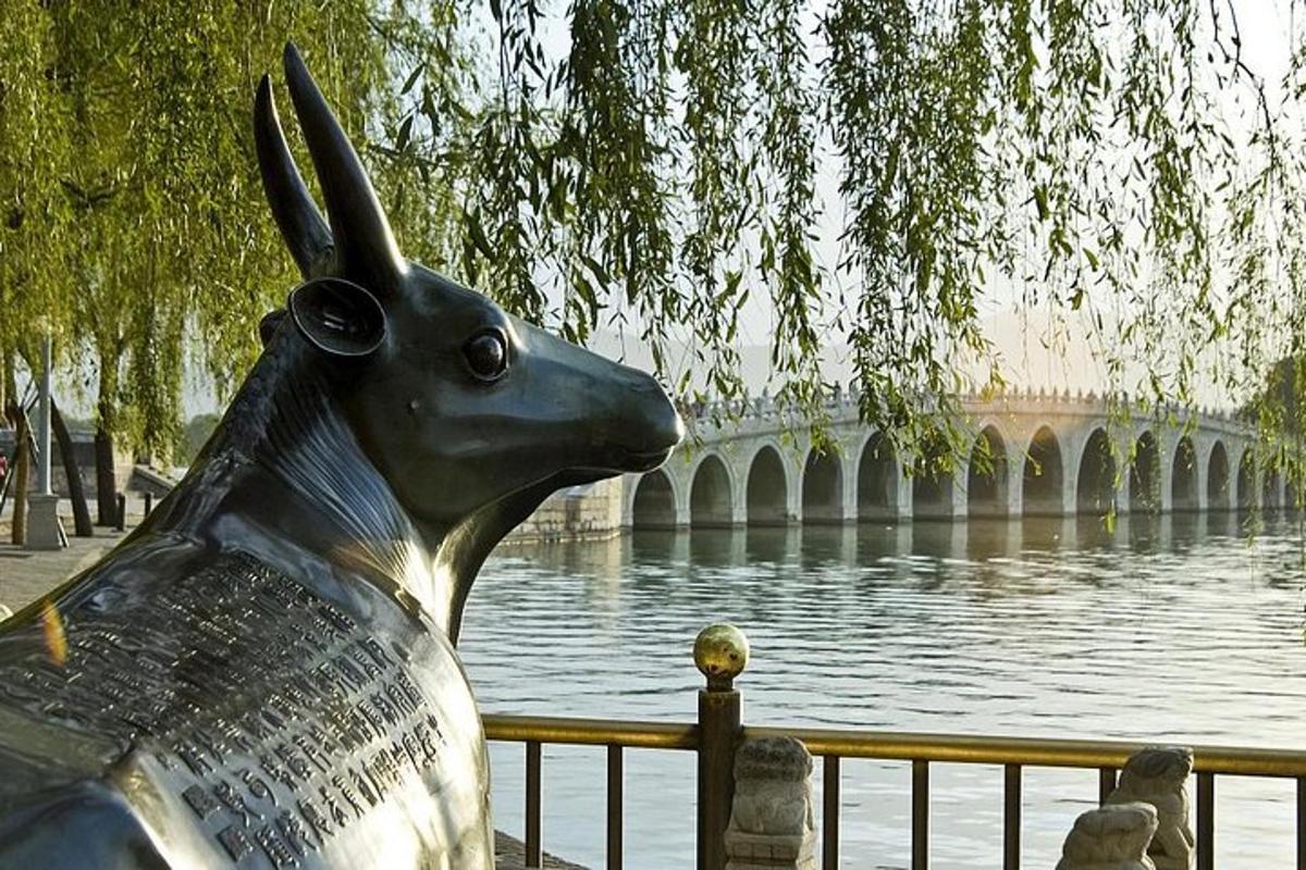 a statue of a rabbit next to a body of water