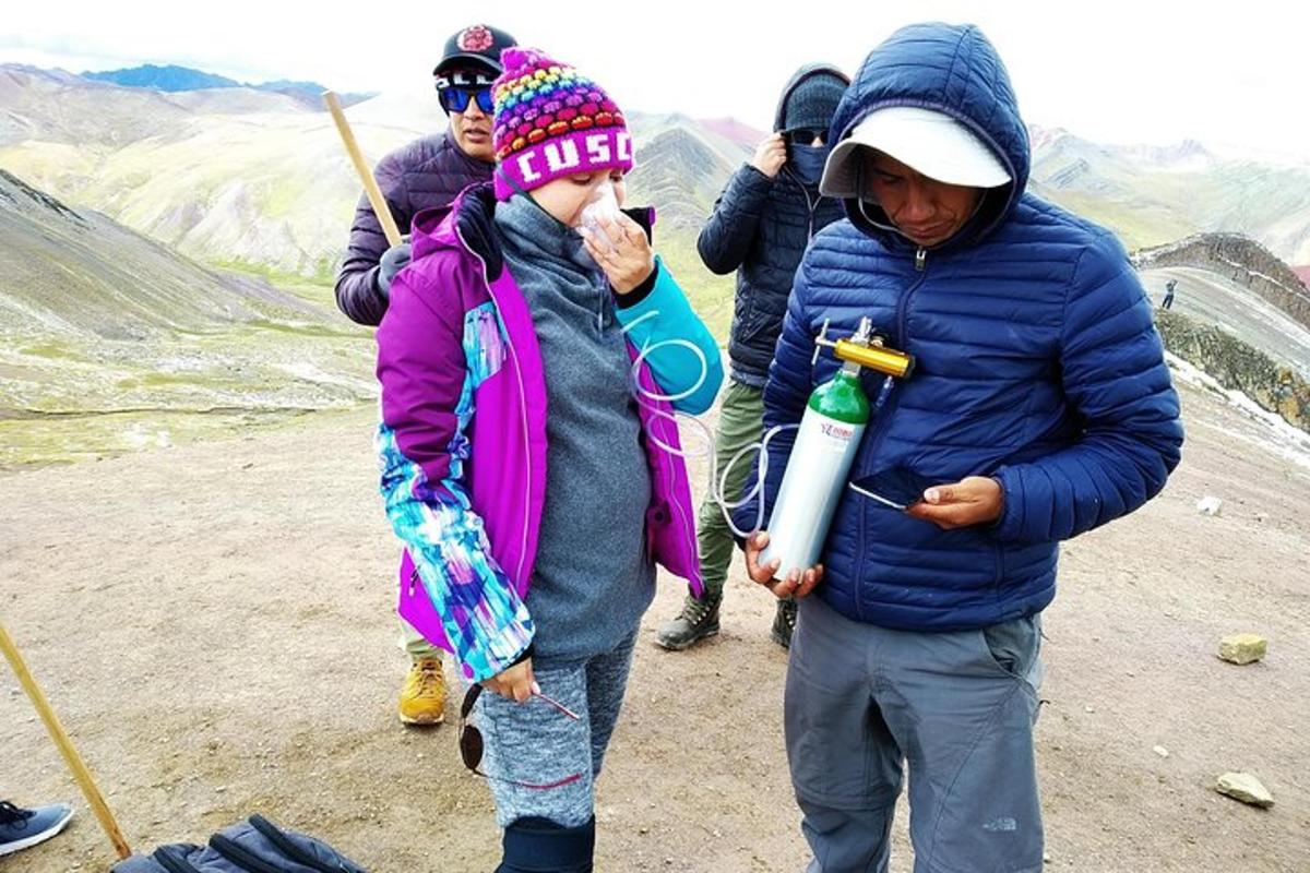 a group of people standing on top of a mountain