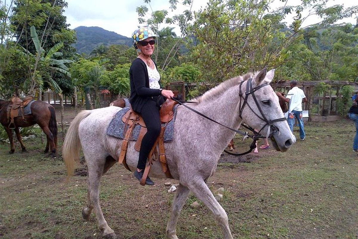 a woman riding on the back of a horse