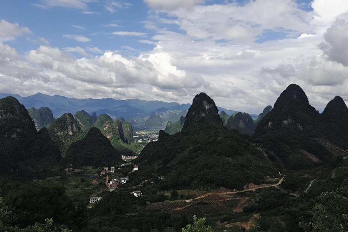 a view of a valley with mountains and a city