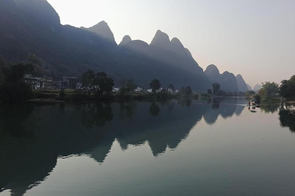 a view of a river with mountains in the background