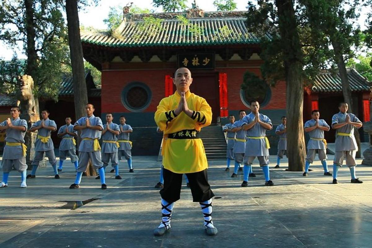 a group of men performing a dance in front of a building