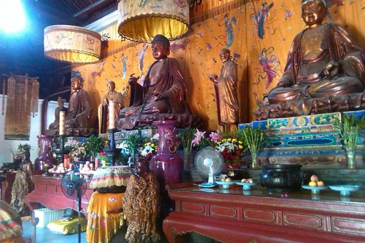 a room with lots of statues on the wall