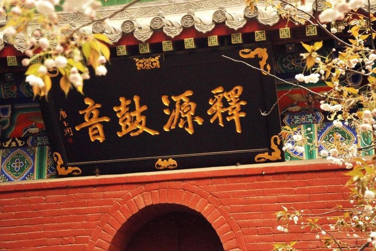 a sign on top of a building with writing on it