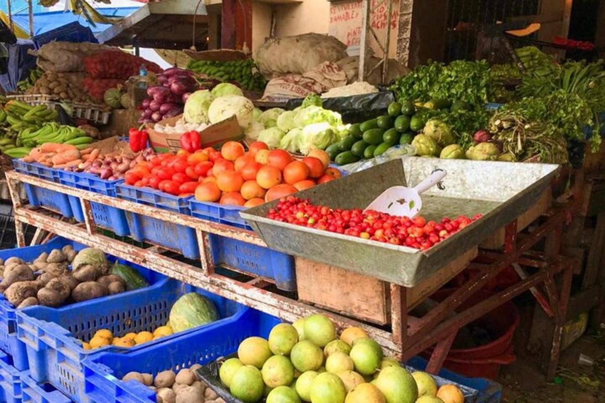 a market with lots of fruits and vegetables on display