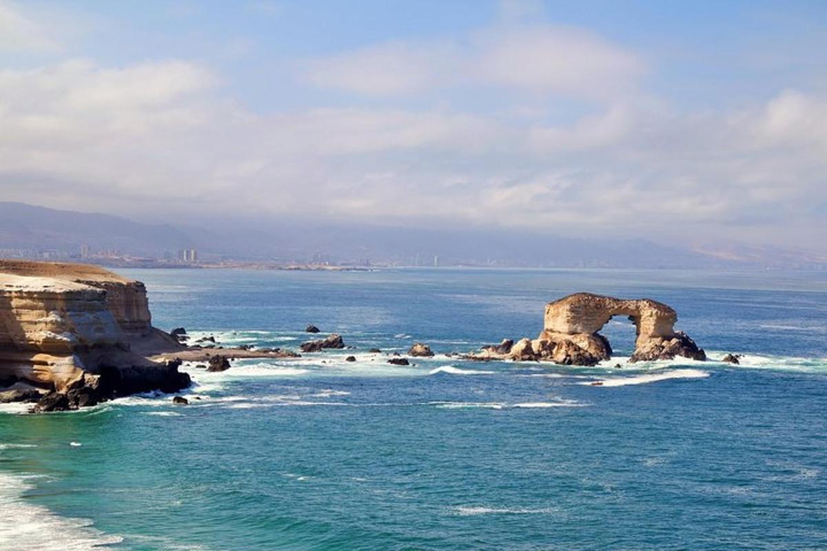 a rock formation in the water near the ocean