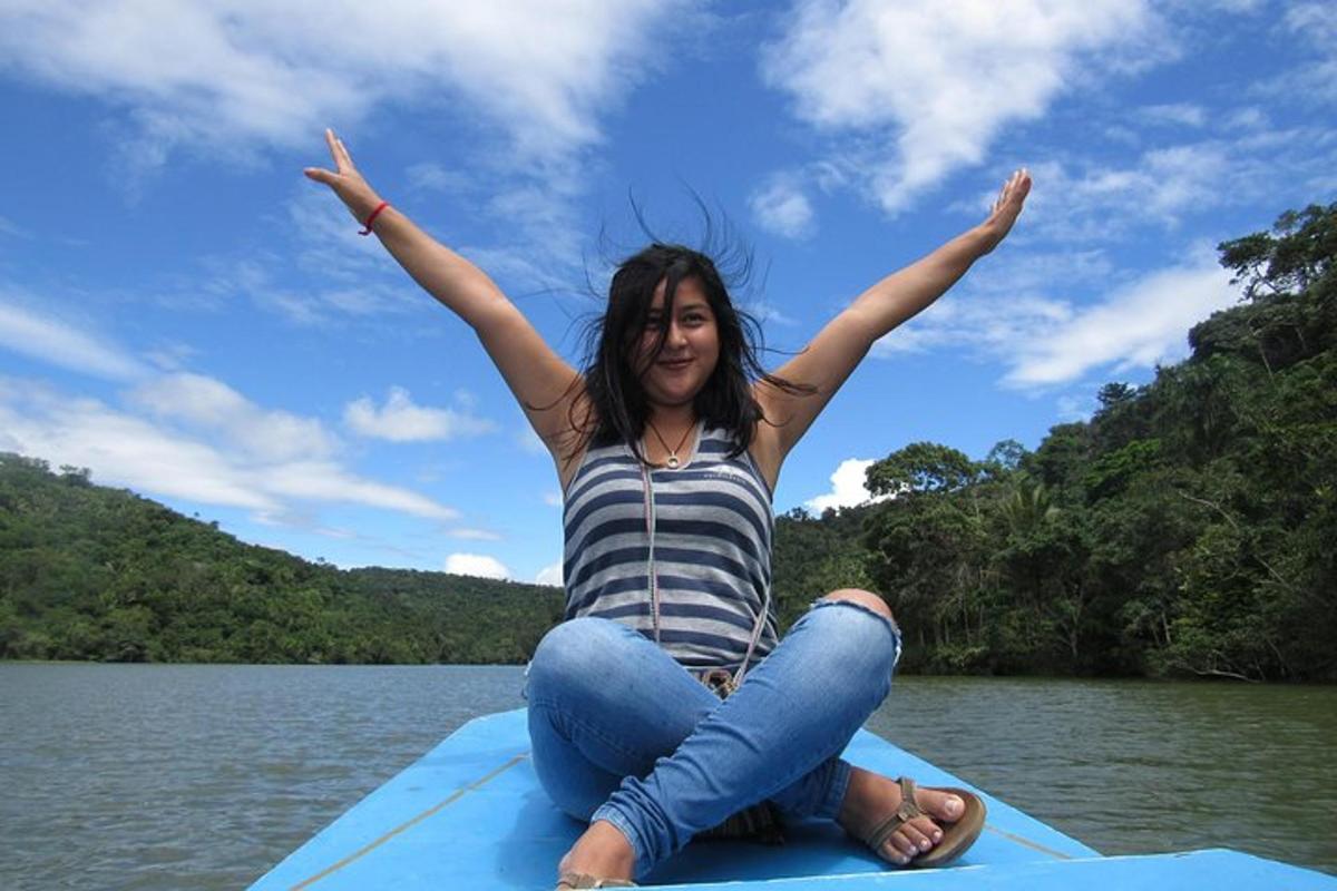 a woman sitting on a raft in the water