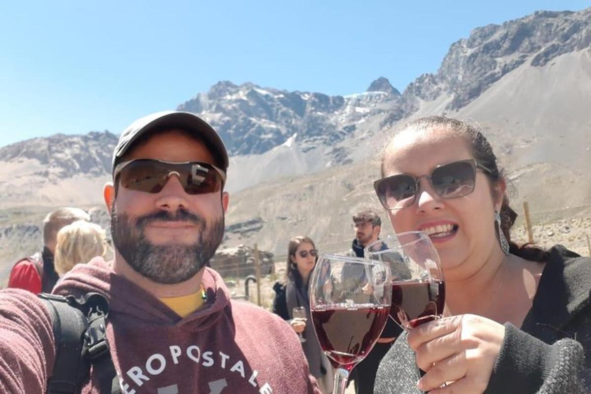 a man and a woman holding glasses of wine