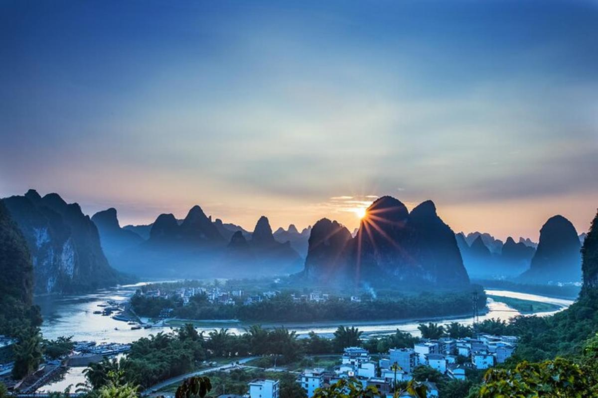 a view of the li river in guilin province at sunset