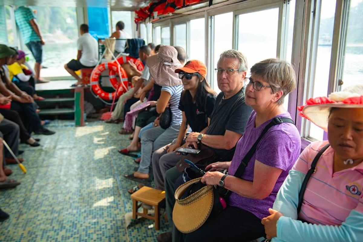 a group of people sitting on a train