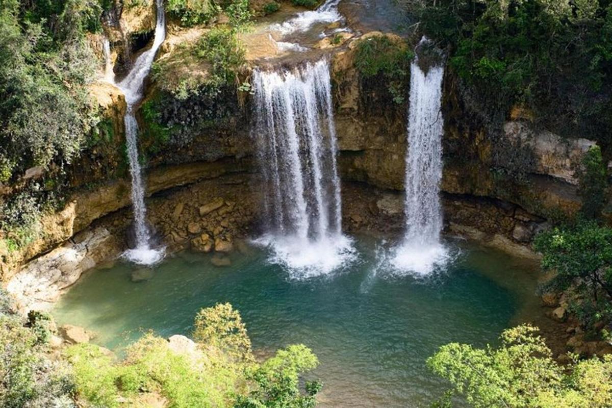 a couple of waterfalls in a pool of water