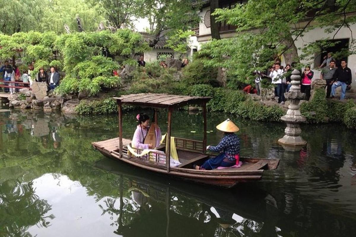 two people in a small boat in the water