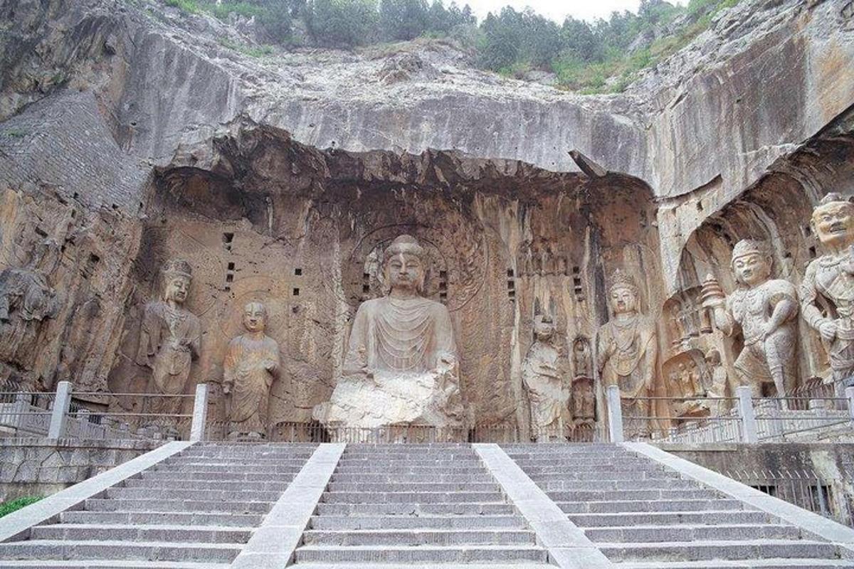 a large statue of a woman in a cave