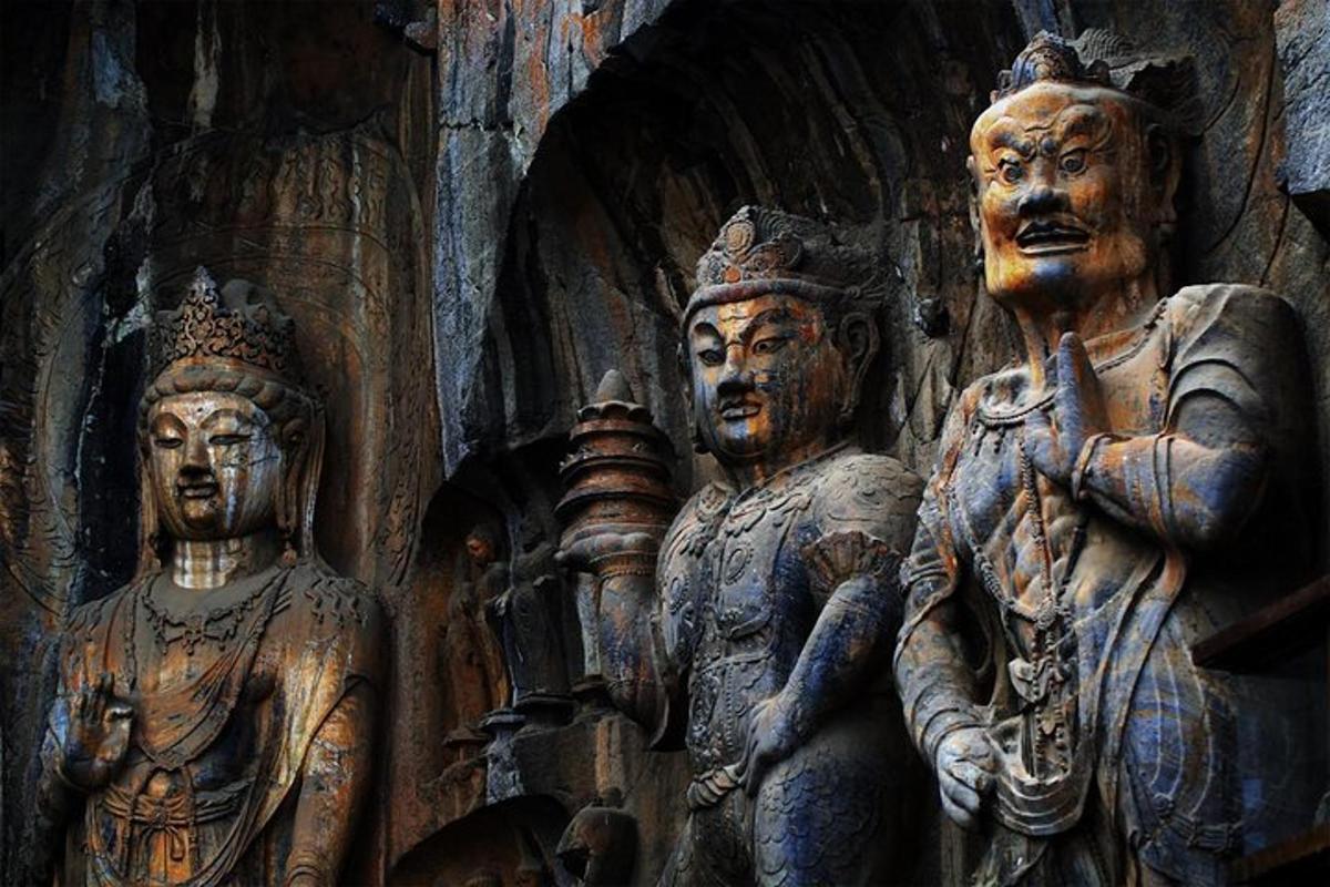 a group of wooden statues on a wall