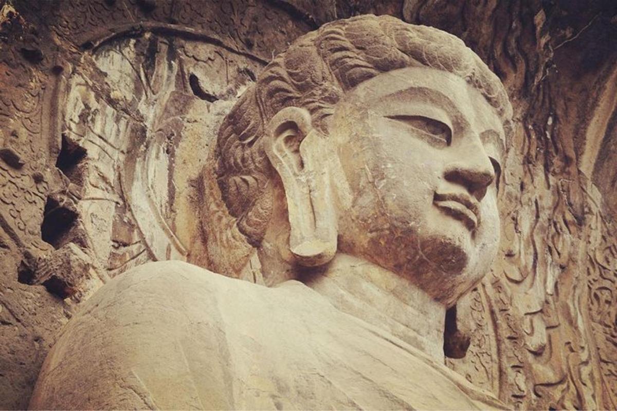 a statue of a head on a wall
