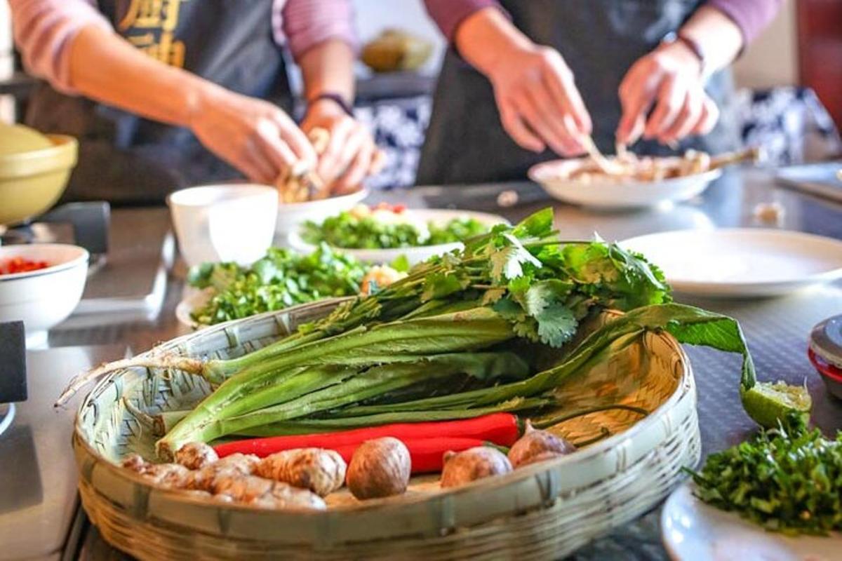 a table topped with a basket filled with vegetables