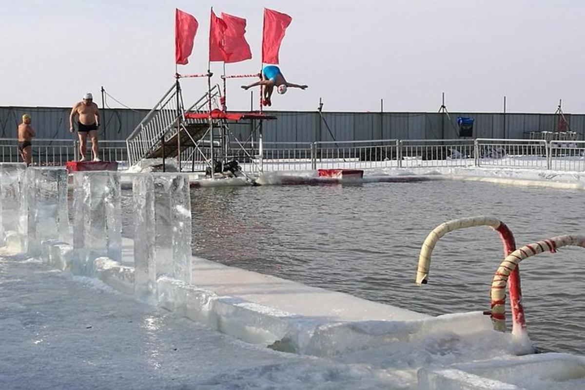 a pool of water with ice on the side of it