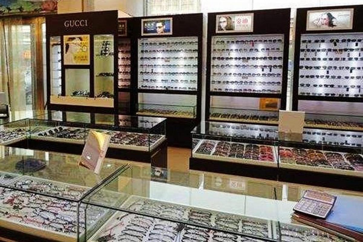 a display case in a bakery with different types of cookies
