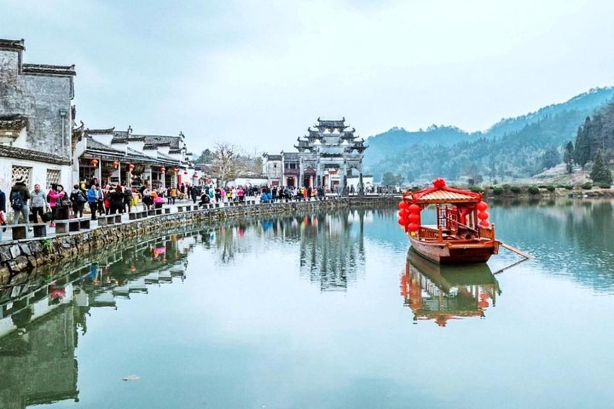 a boat in a river with buildings in the background